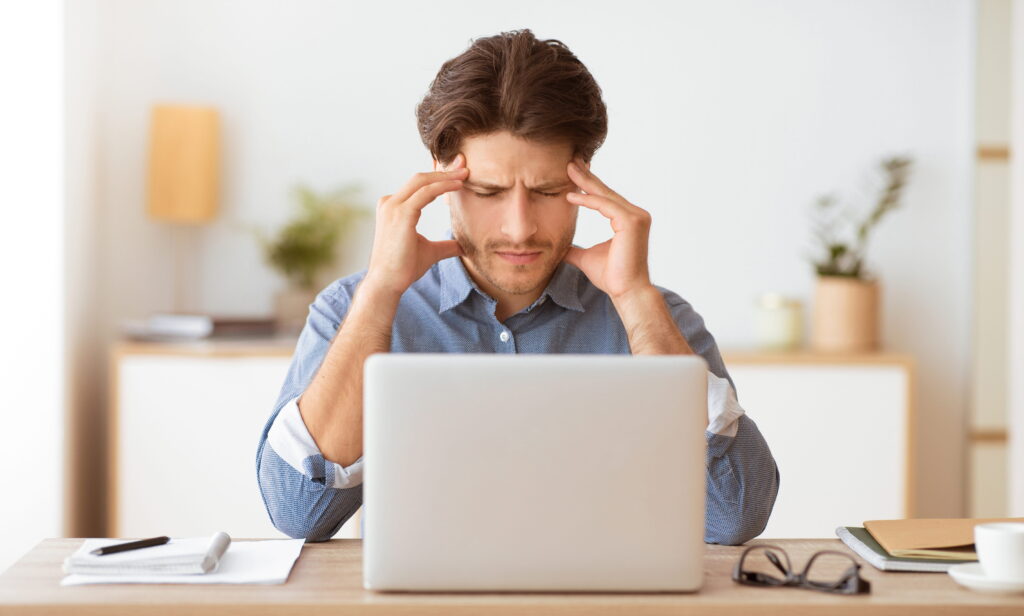 Business owner reviewing IT health check results to assess system performance and security
