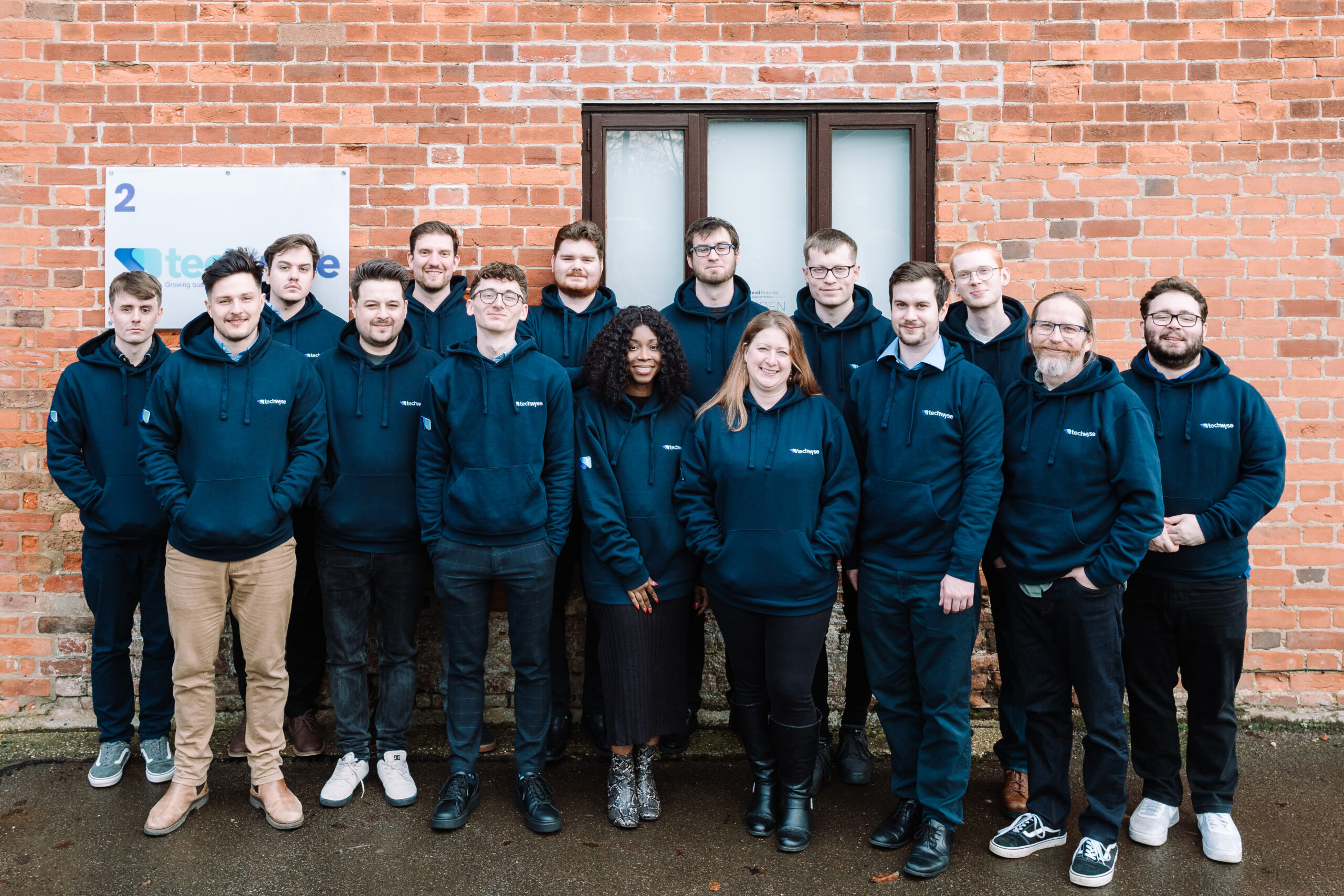 Our TechWyse team smiling outside our Essex office.